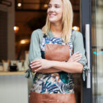 A female employee wearing a flowered apron